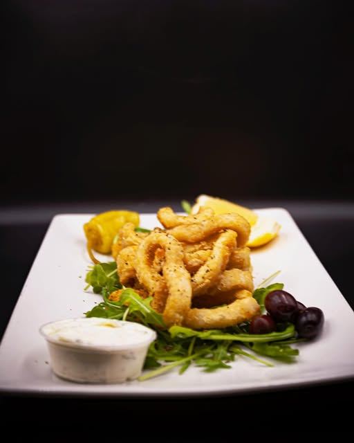 Fried calamari with tzatziki and olives