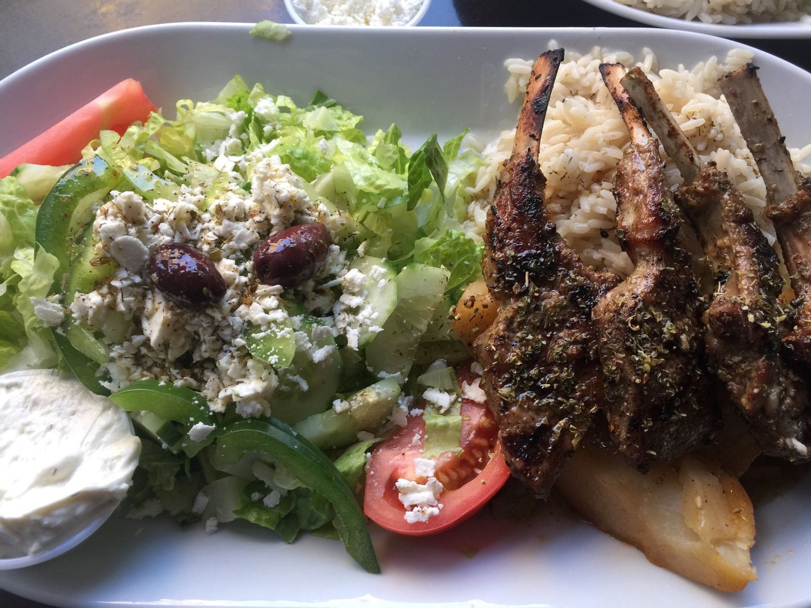 Grilled lamb chops with Greek salad and tzatziki